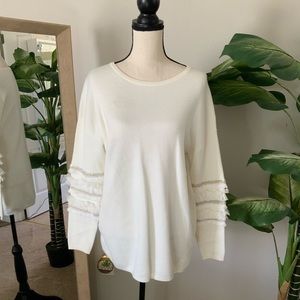 White sweater with sleeve detail